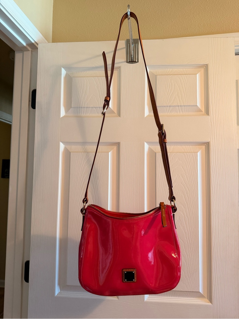 Dooney & Bourke Glossy Hot Pink Patent Crossbody with Brown Strap